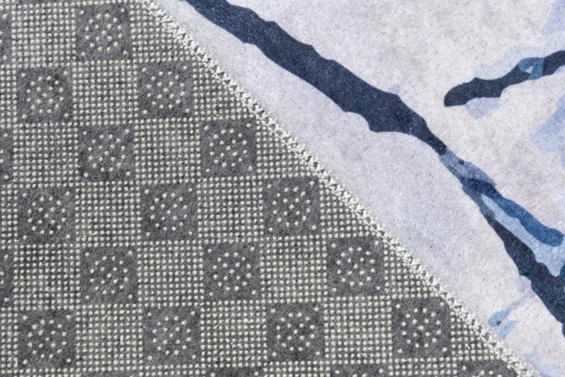 Semplice tappeto bianco e blu con motivo astratto