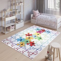 Detský koberec s motívom farebného puzzle 