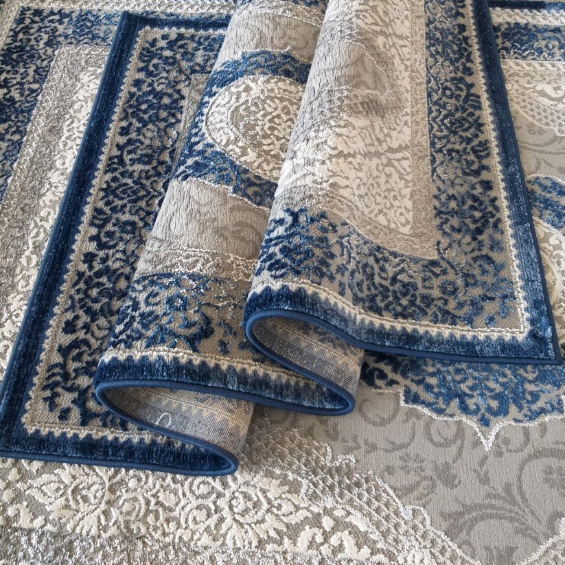 Exklusiver blauer Teppich im Vintage-Stil
