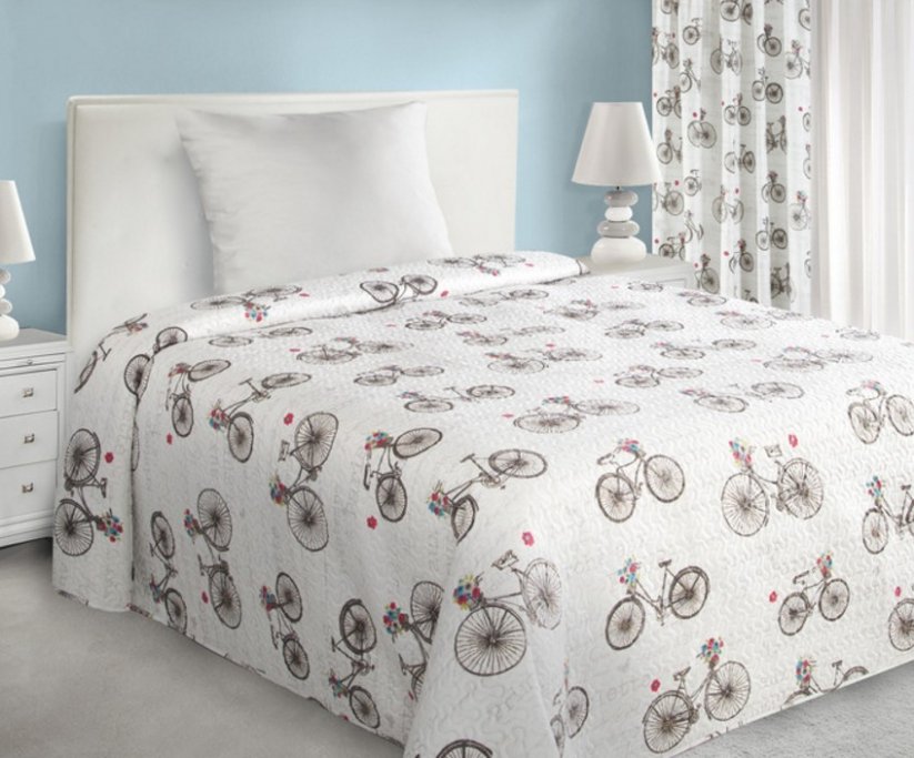 Cuvertură de pat maro deschis, cu un model de bicicletă