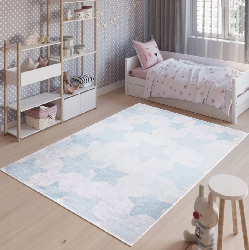 Kinderteppich mit blauem Sternenmotiv