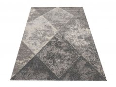 Moderner grauer Teppich mit Rautenmotiv für das Wohnzimmer