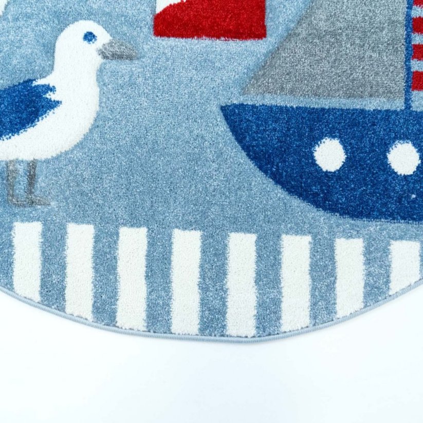 Kulatý koberec s námořnickým motivem modré barvy